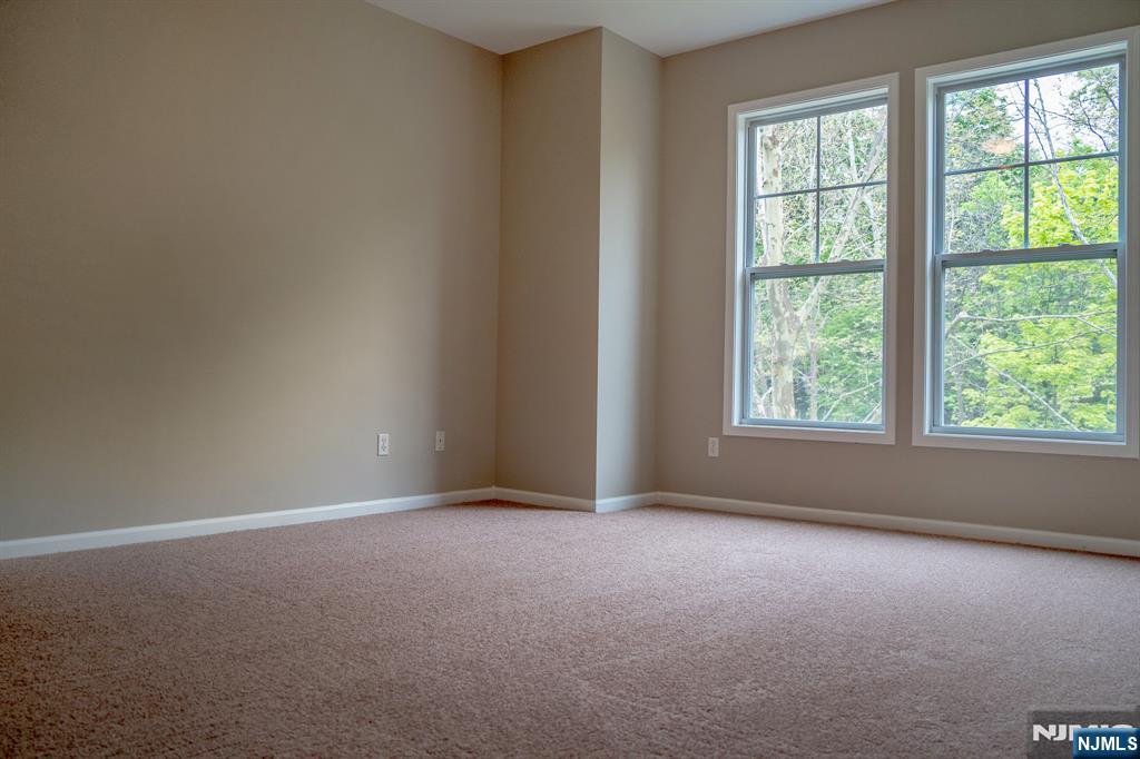 804 River Place Butler, NJ 07405 - Photo 28 of 32 an empty room with windows
