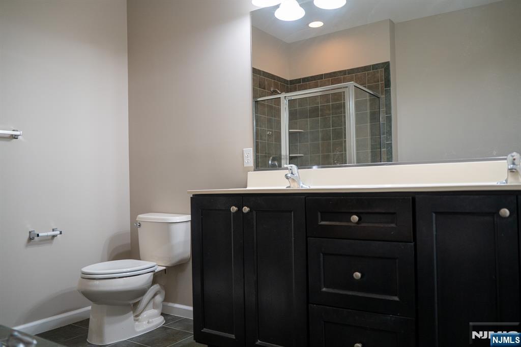 804 River Place Butler, NJ 07405 - Photo 31 of 32 a bathroom with a sink and a toilet