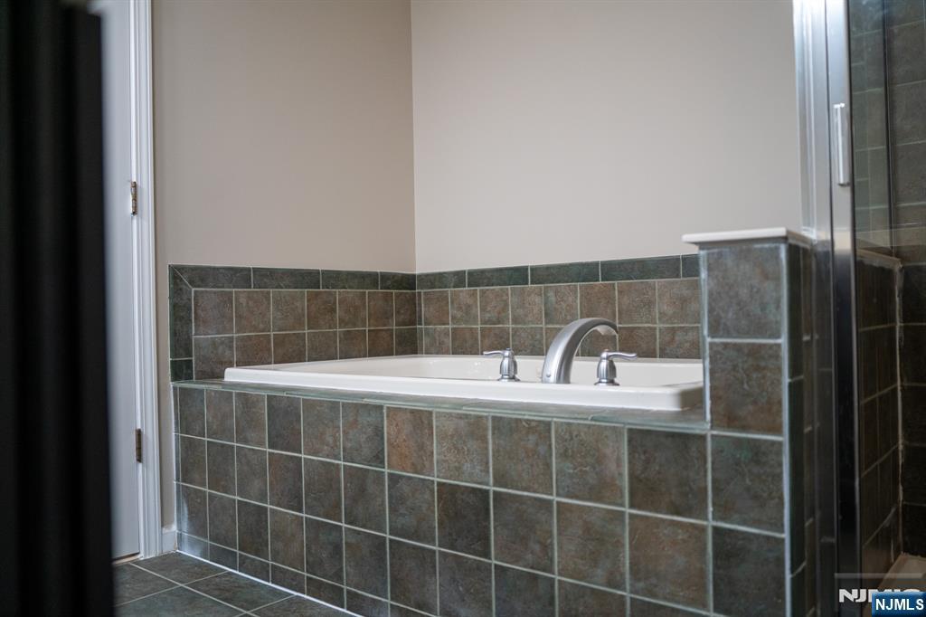 804 River Place Butler, NJ 07405 - Photo 32 of 32 a bathroom with a shower