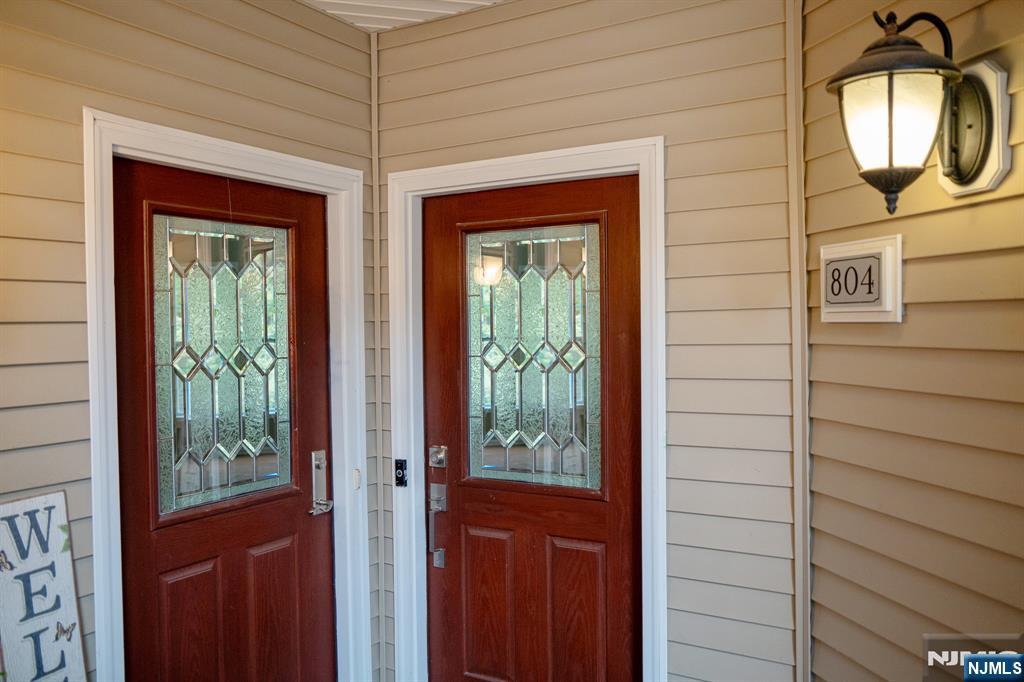 804 River Place Butler, NJ 07405 - Photo 4 of 32 a view of a brick house with front door
