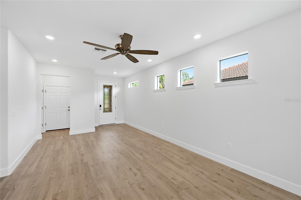 17029 Hampton Falls Terrace Lakewood Ranch, FL 34202 - Photo 13 of 56 a view of empty room with wooden floor
