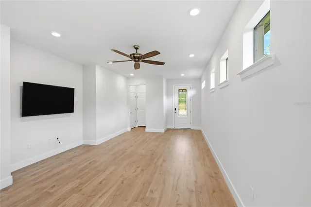 a kitchen with stainless steel appliances a stove a sink and cabinets