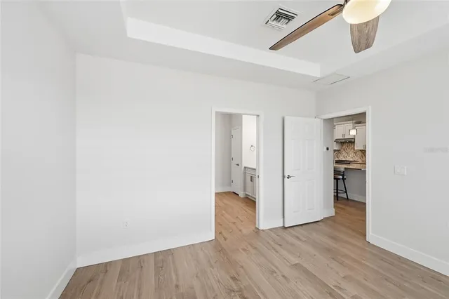 a spacious bathroom with a double vanity sink and a mirror