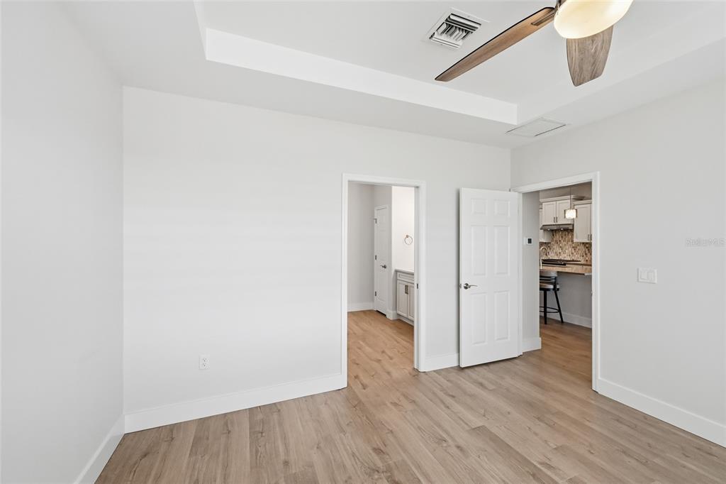 17029 Hampton Falls Terrace Lakewood Ranch, FL 34202 - Photo 24 of 56 a view of a hallway with wooden floor and closet