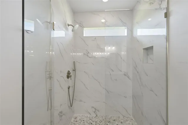 an empty room with wooden floor and closet