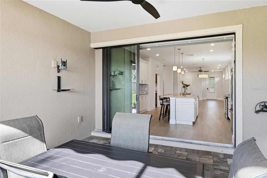 17029 Hampton Falls Terrace Lakewood Ranch, FL 34202 - Photo 38 of 56 a living room with furniture and a table