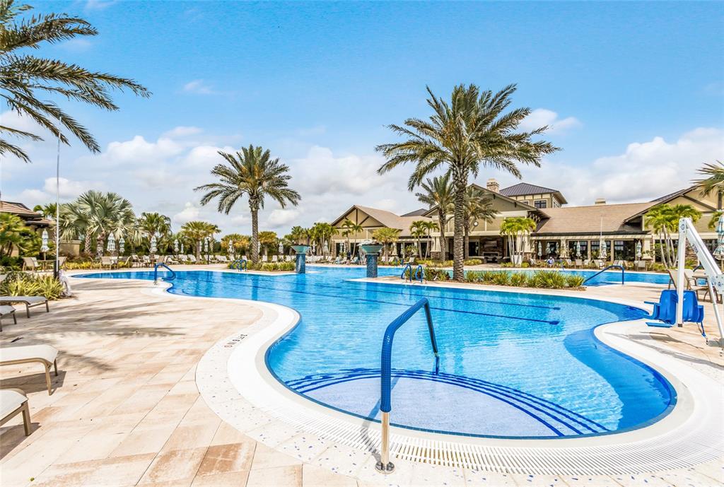 17029 Hampton Falls Terrace Lakewood Ranch, FL 34202 - Photo 53 of 56 a view of a swimming pool with sitting area