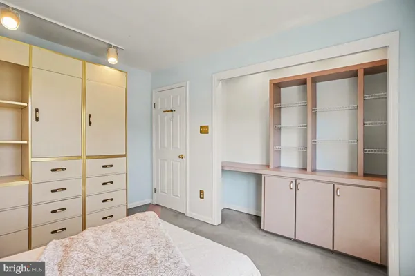 a bathroom with a sink a toilet and shower curtain
