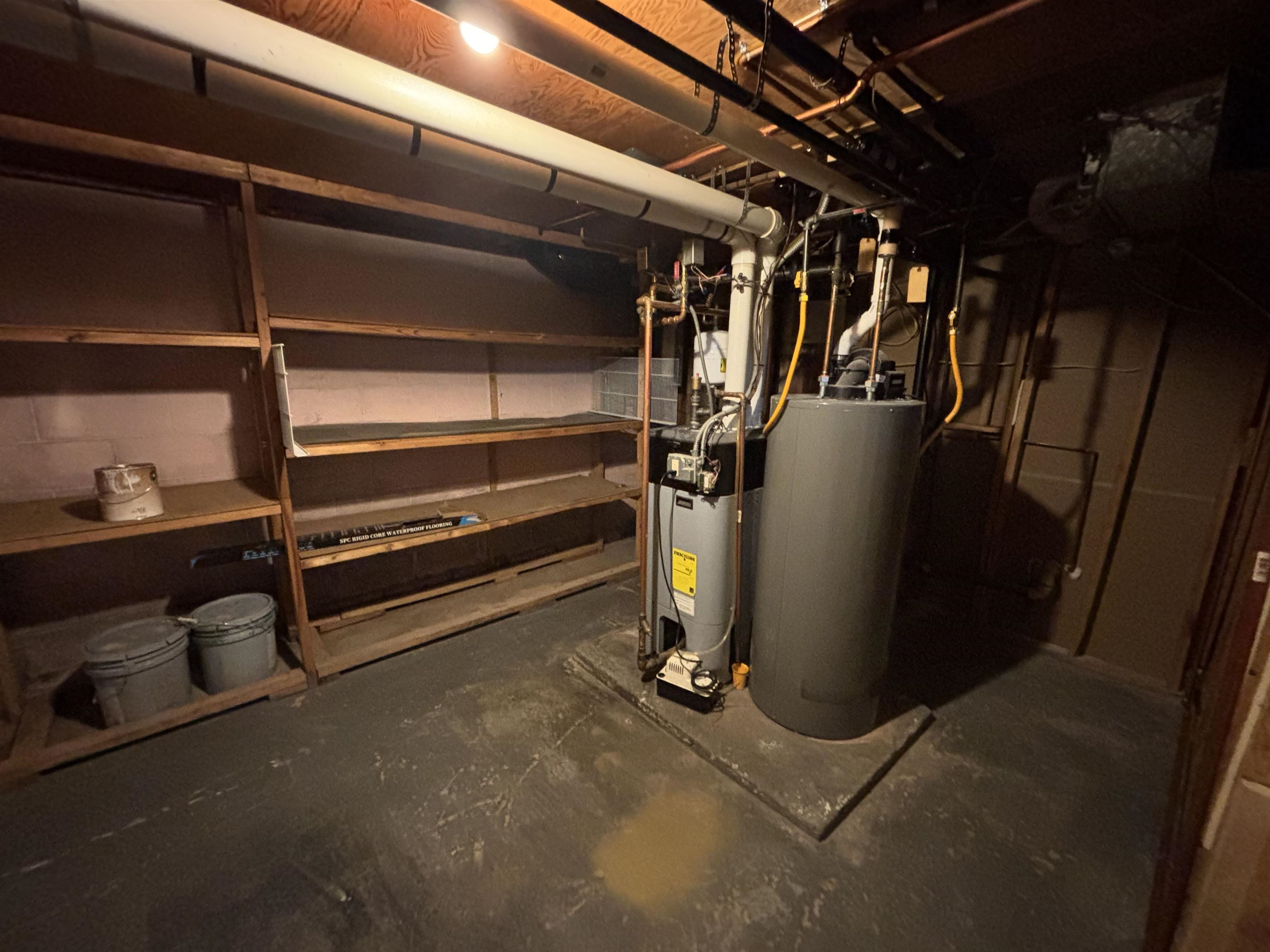 4919 Oakley Street Duluth, MN 55804 - Photo 16 of 20 Unfinished basement with water heater