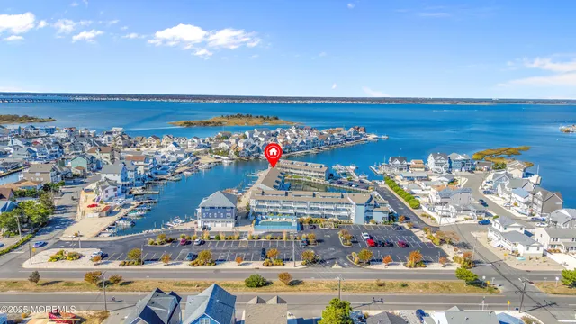 an aerial view of a house with a ocean view