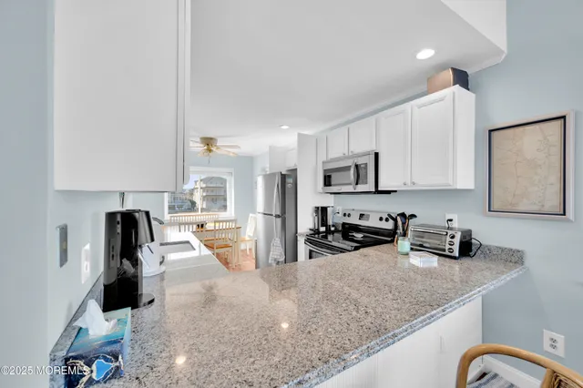 a kitchen with stainless steel appliances granite countertop a stove and a sink