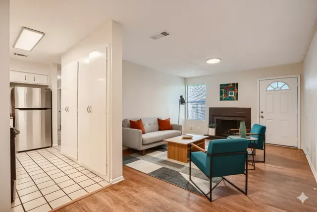 a living room with furniture and a fireplace