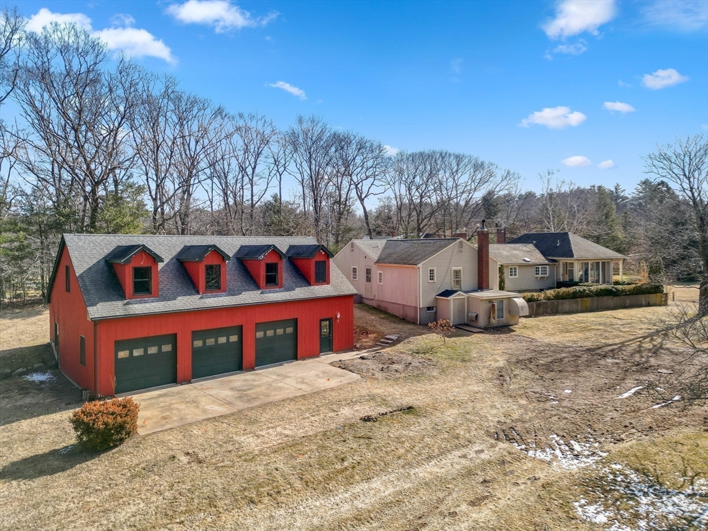 a view of house with outdoor space and sitting area