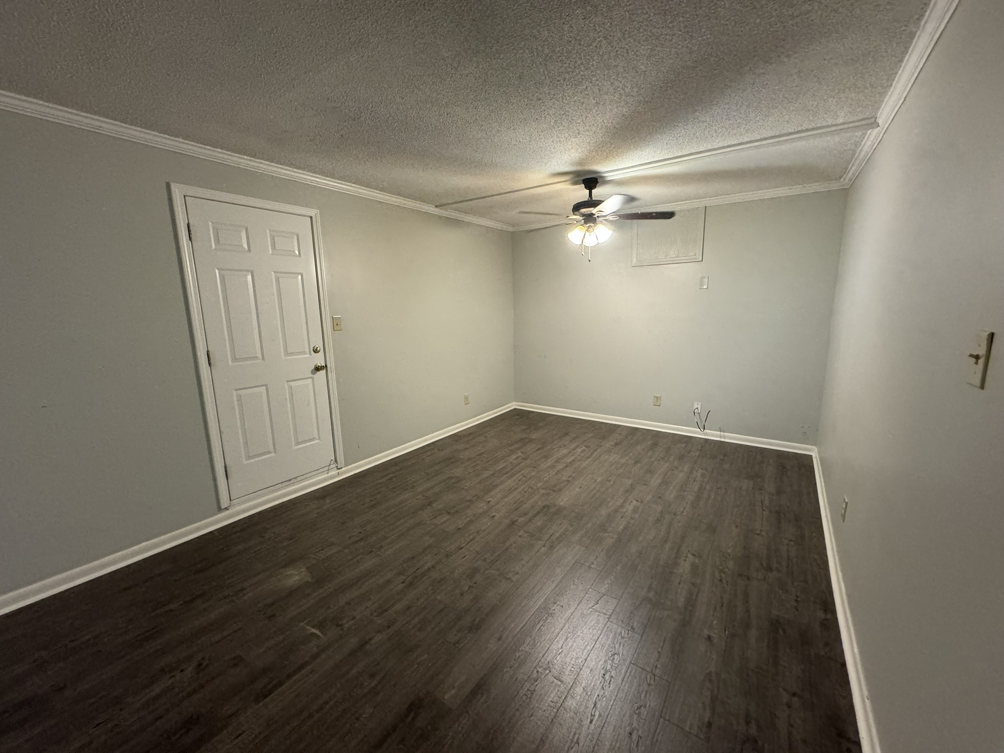 2523 Syon Drive Memphis, TN 38119 - Photo 18 of 54 an empty room with wooden floor and fan