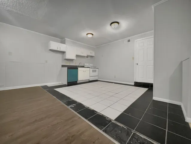 an empty room with wooden floor