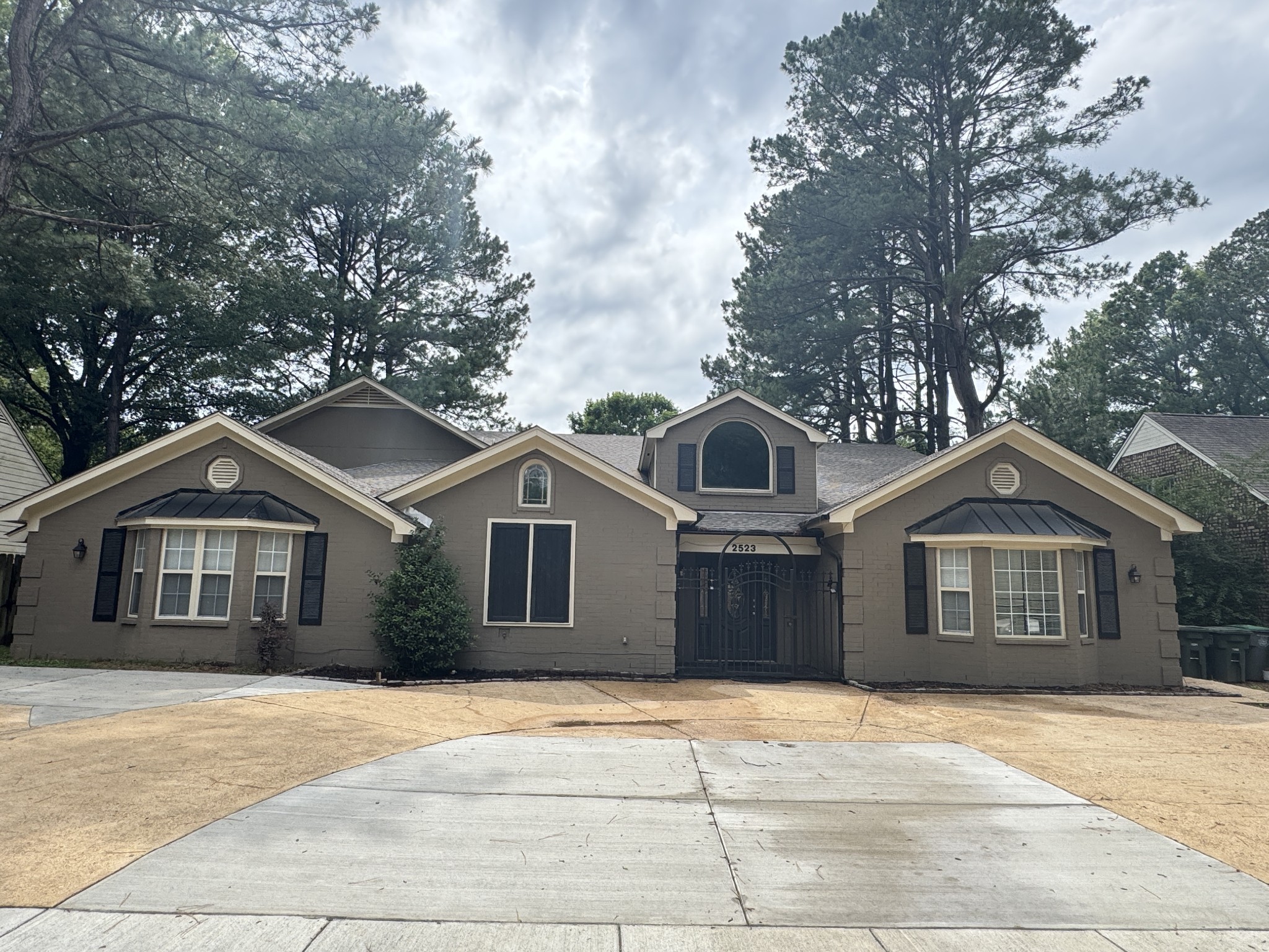 2523 Syon Drive Memphis, TN 38119 - Photo 2 of 54 a front view of a house with a garden