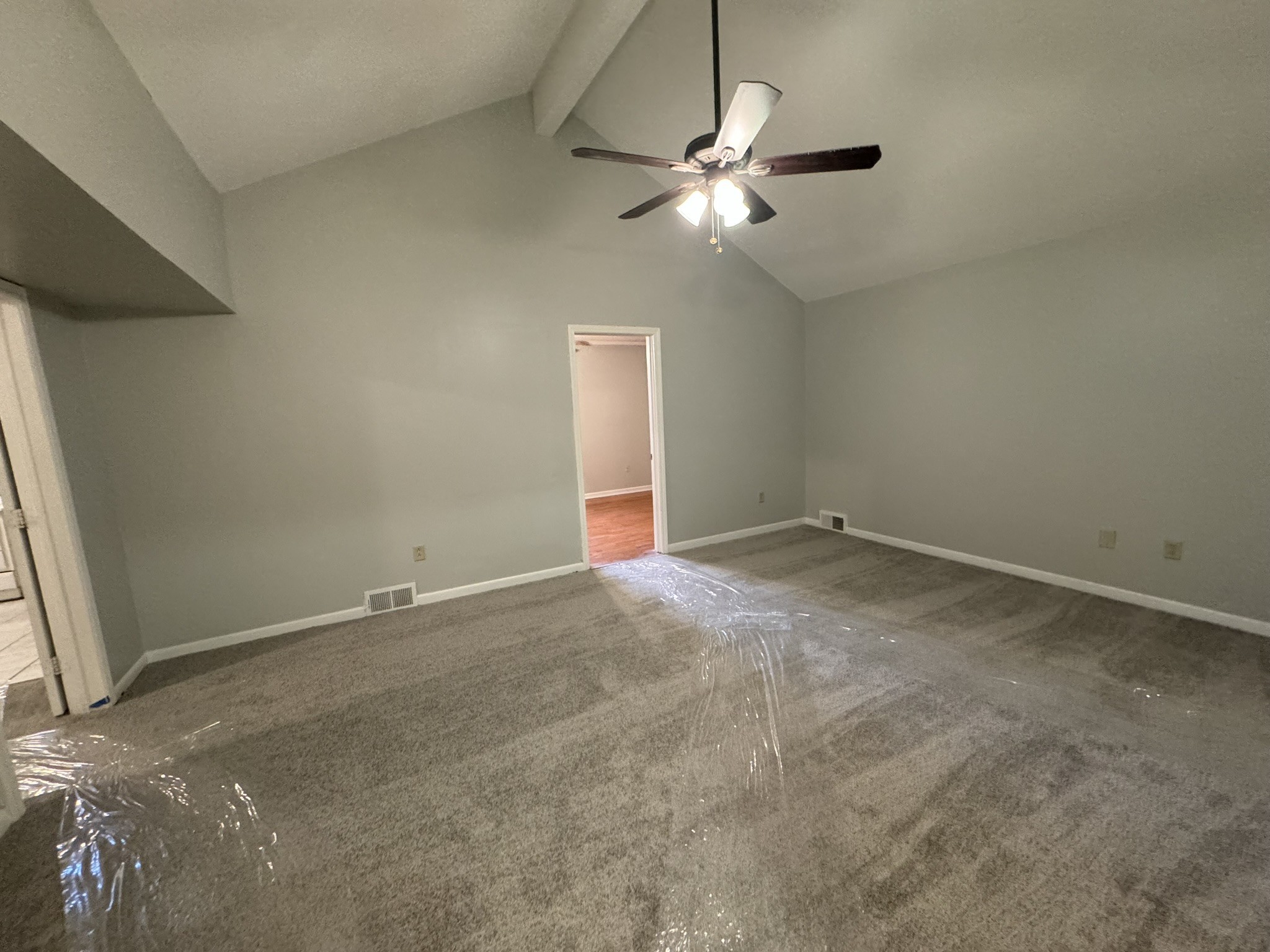2523 Syon Drive Memphis, TN 38119 - Photo 39 of 54 an empty room with a chandelier fan and windows