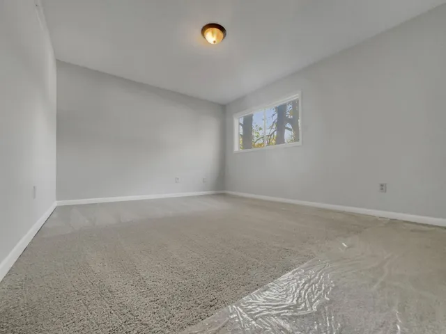 a spacious bathroom with a double vanity sink and mirror