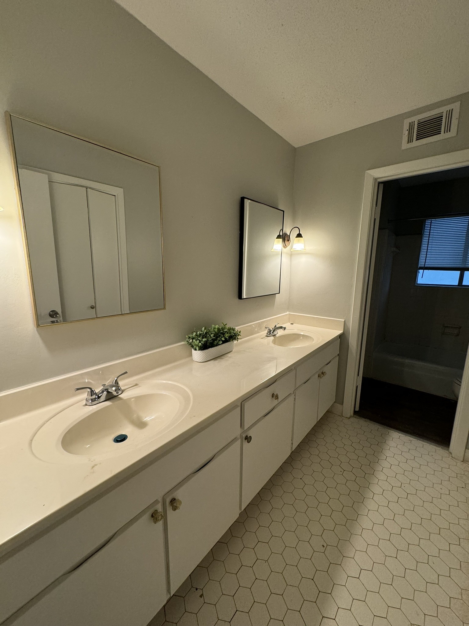 2523 Syon Drive Memphis, TN 38119 - Photo 47 of 54 a spacious bathroom with a double vanity sink and mirror