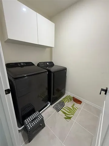 a view of a house with backyard and swimming pool