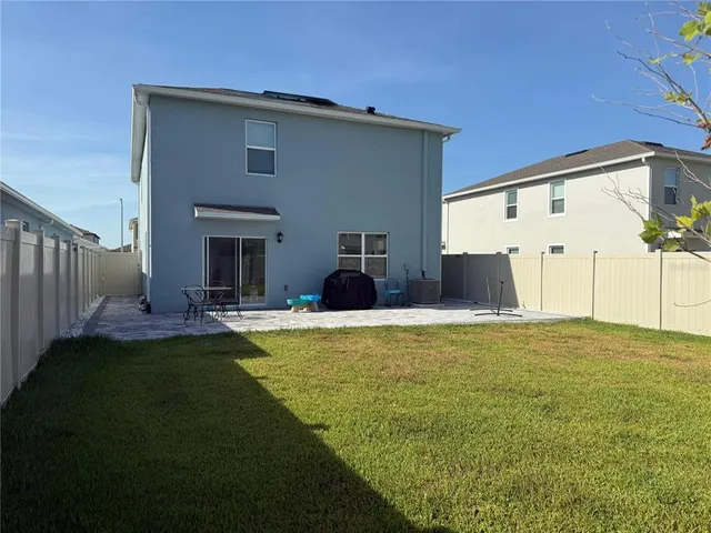 a view of a big yard next to a house