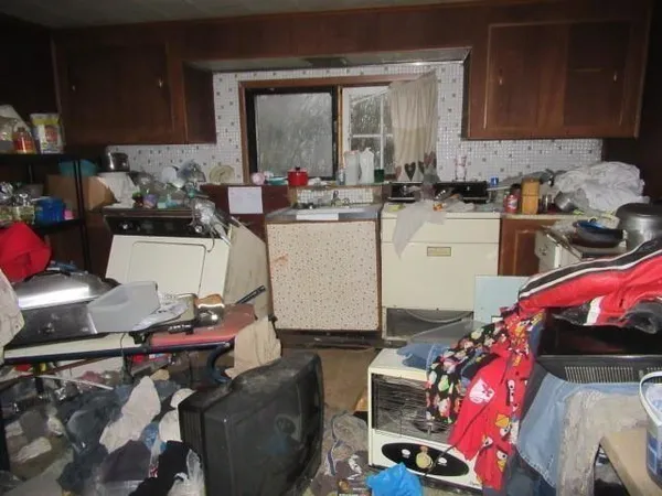 a kitchen with a sink appliances and cabinets