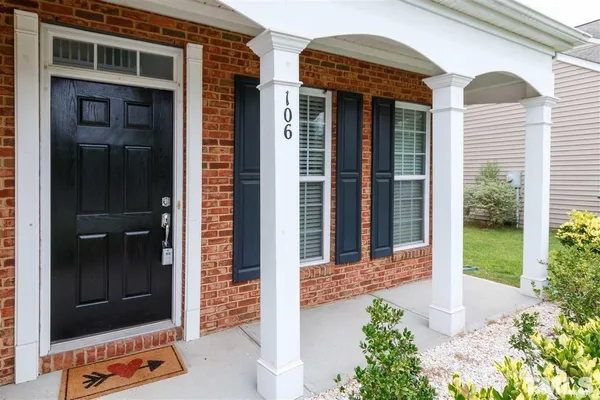 a front view of a house with a porch