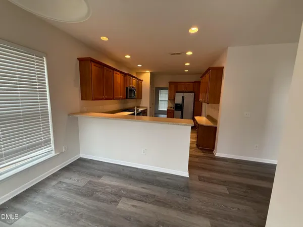 a view of kitchen with furniture and wooden floor