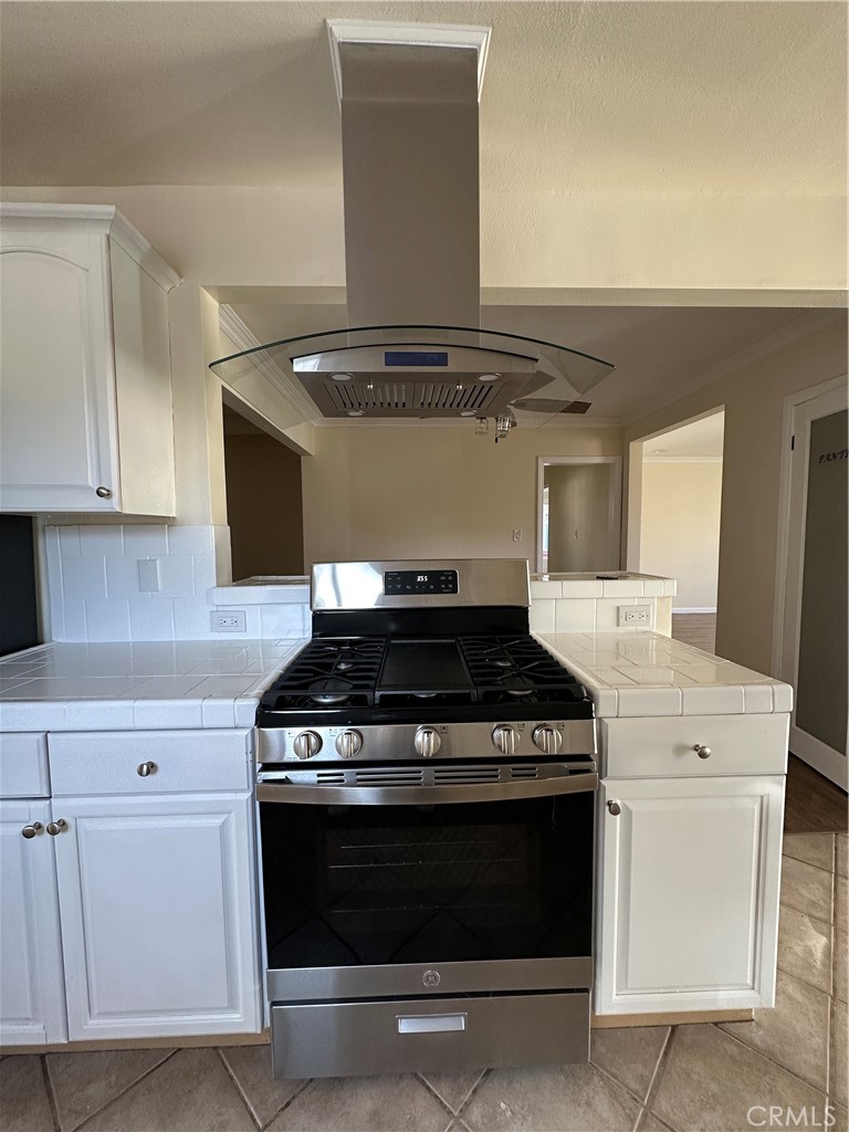 6447 Balcom Avenue Reseda, CA 91335 - Photo 17 of 49 a stove top oven sitting inside of a kitchen