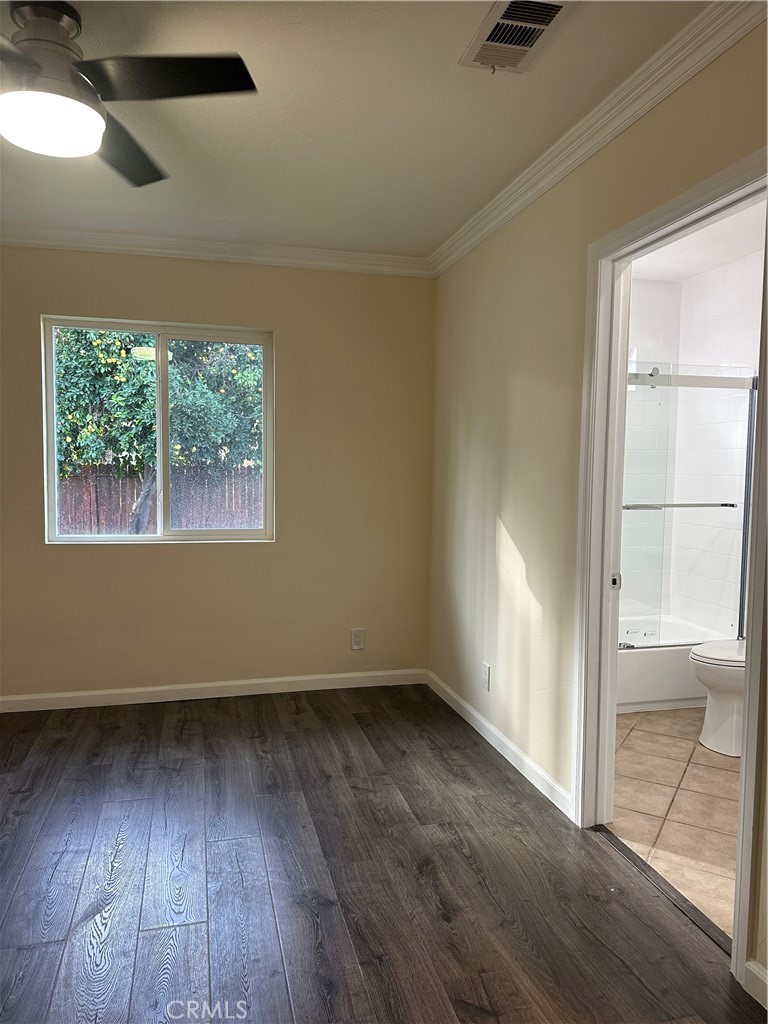 6447 Balcom Avenue Reseda, CA 91335 - Photo 41 of 49 an empty room with wooden floor and windows