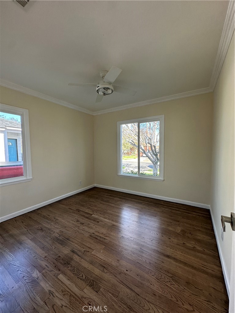 6447 Balcom Avenue Reseda, CA 91335 - Photo 45 of 49 an empty room with wooden floor and windows