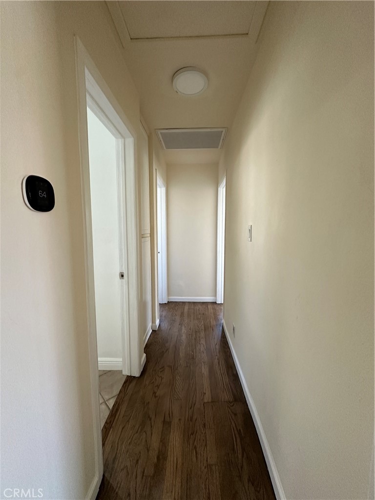 6447 Balcom Avenue Reseda, CA 91335 - Photo 47 of 49 a view of a hallway with wooden floor