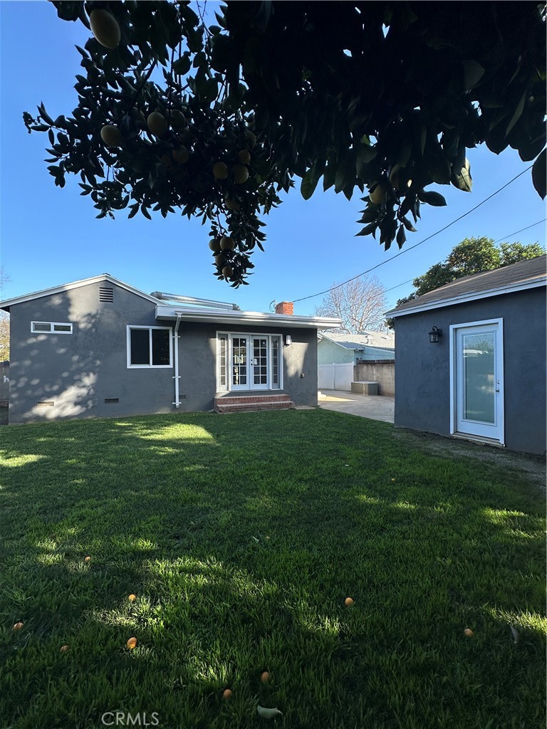 6447 Balcom Avenue Reseda, CA 91335 - Photo 8 of 49 a front view of a house with a garden