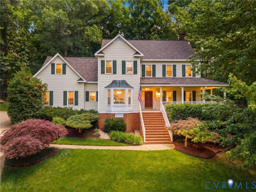 2011 Gamelaw Court Midlothian, VA 23113 - Photo 2 of 77 a front view of a house with a garden and plants