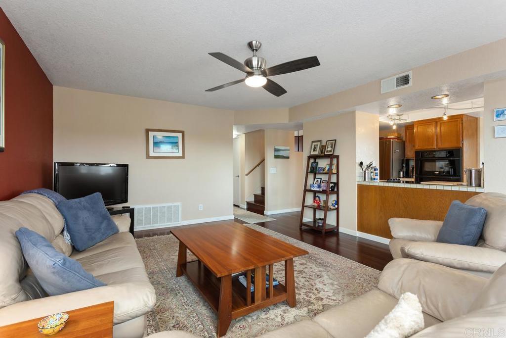 1570 Pacific Ranch Drive Encinitas, CA 92024 - Photo 14 of 35 a living room with furniture and a ceiling fan