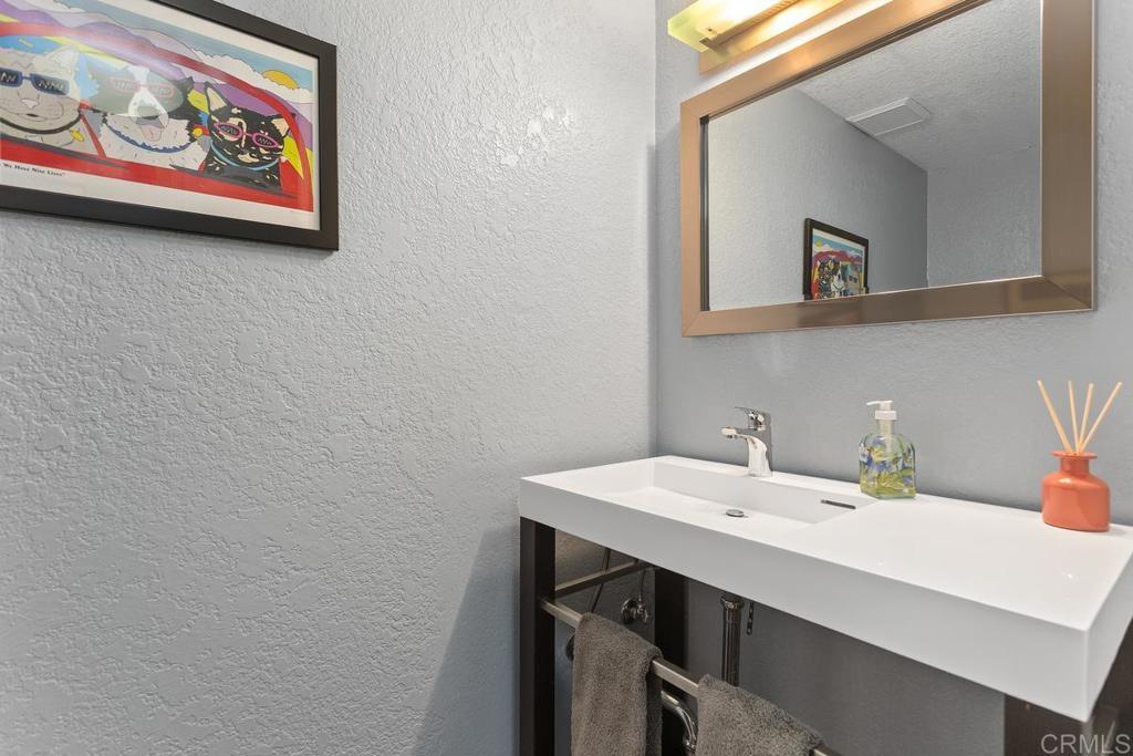 1570 Pacific Ranch Drive Encinitas, CA 92024 - Photo 15 of 35 a bathroom with a sink and a mirror