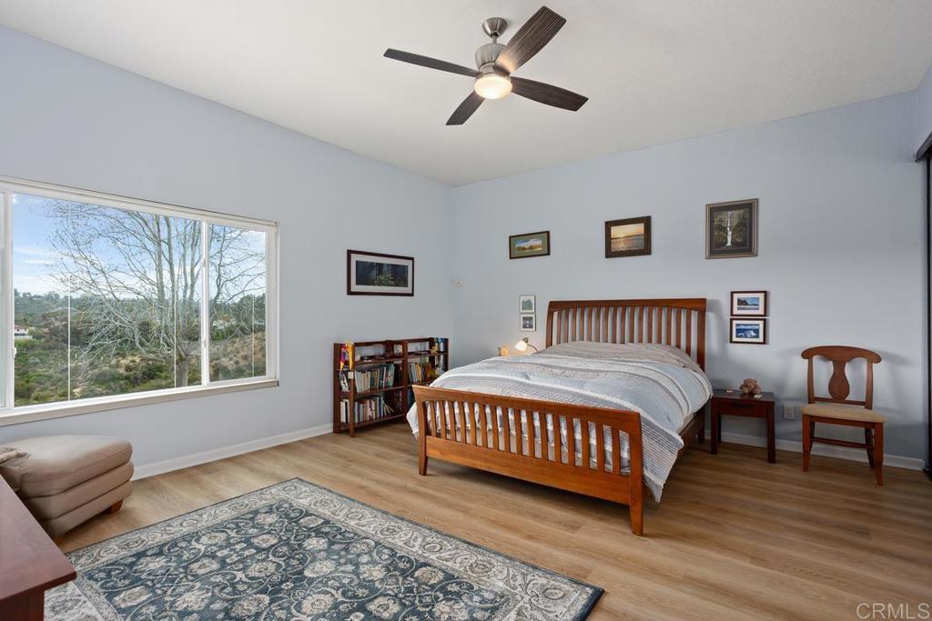 1570 Pacific Ranch Drive Encinitas, CA 92024 - Photo 17 of 35 a bedroom with a bed and a couch