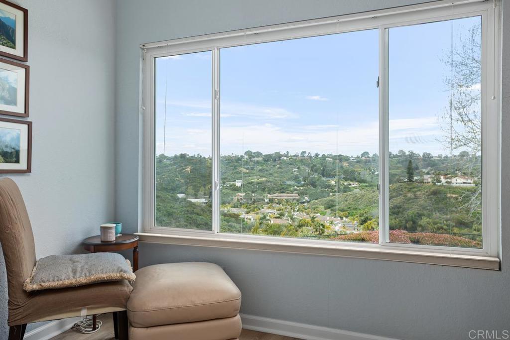 1570 Pacific Ranch Drive Encinitas, CA 92024 - Photo 18 of 35 a room with a large window and a bed