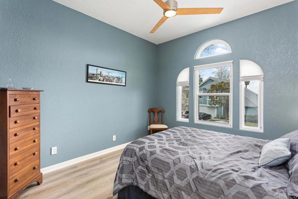 1570 Pacific Ranch Drive Encinitas, CA 92024 - Photo 20 of 35 a bedroom with a bed and a window