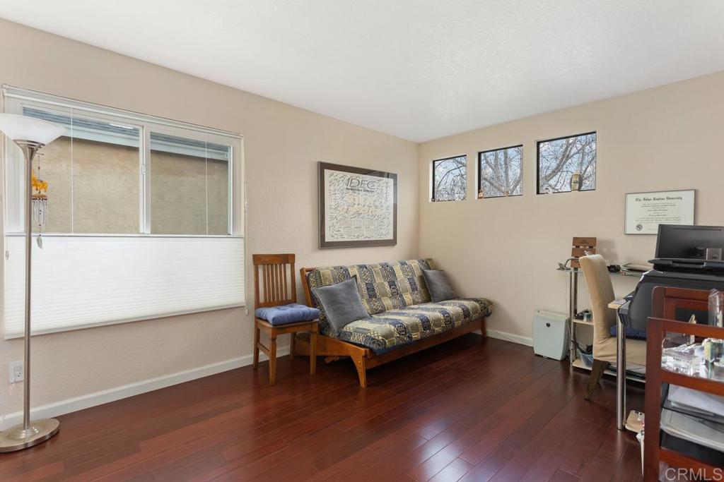 1570 Pacific Ranch Drive Encinitas, CA 92024 - Photo 22 of 35 a living room with furniture and a flat screen tv