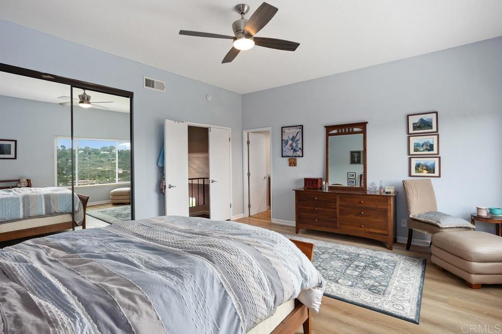 1570 Pacific Ranch Drive Encinitas, CA 92024 - Photo 23 of 35 a bedroom with a bed window and couch