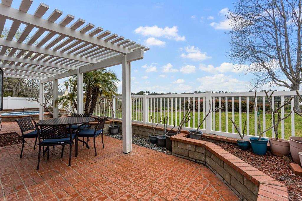 1570 Pacific Ranch Drive Encinitas, CA 92024 - Photo 26 of 35 a garden view with a seating space