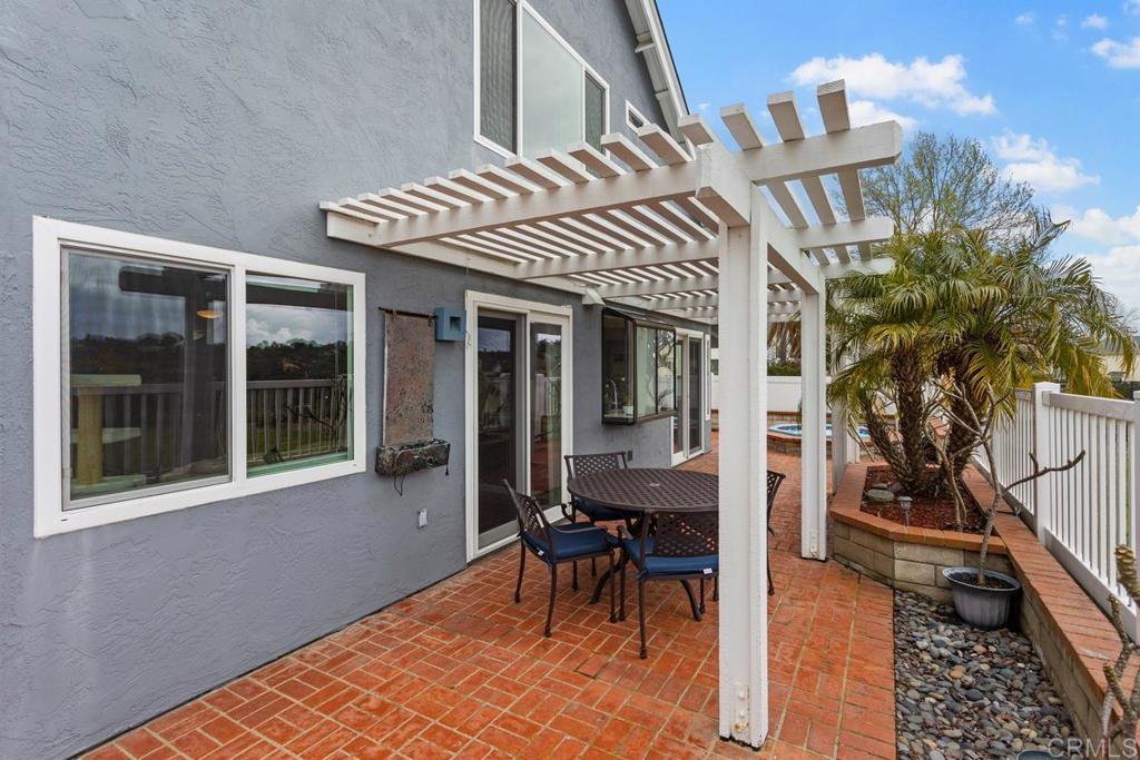1570 Pacific Ranch Drive Encinitas, CA 92024 - Photo 27 of 35 a view of a house with backyard and sitting area