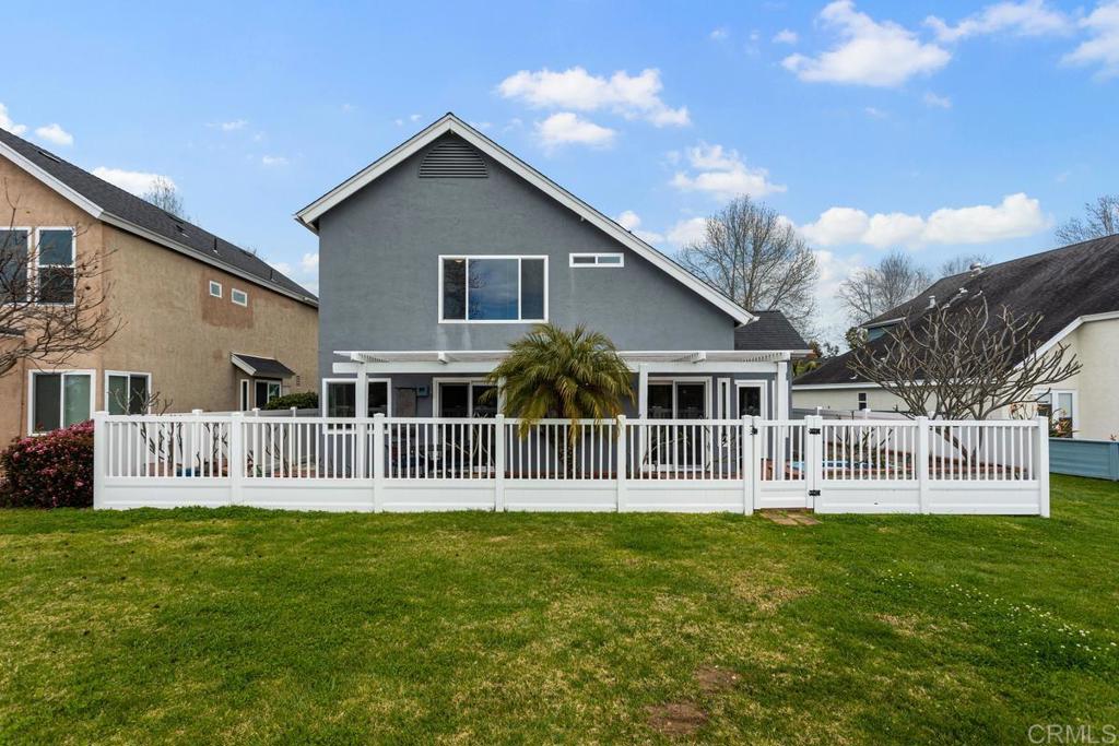 1570 Pacific Ranch Drive Encinitas, CA 92024 - Photo 29 of 35 a front view of house with yard and outdoor seating