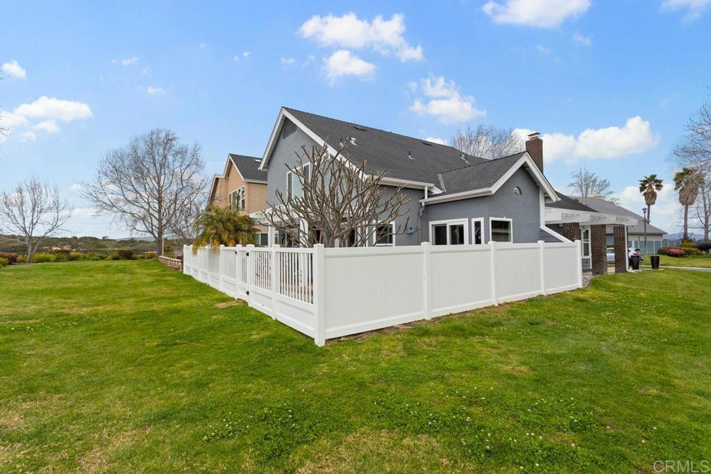 1570 Pacific Ranch Drive Encinitas, CA 92024 - Photo 30 of 35 a front view of a house with a yard