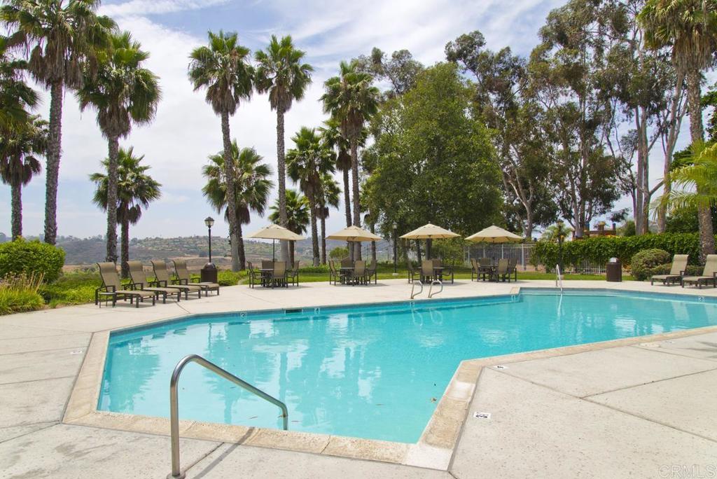 1570 Pacific Ranch Drive Encinitas, CA 92024 - Photo 32 of 35 a view of a swimming pool with lounge chairs