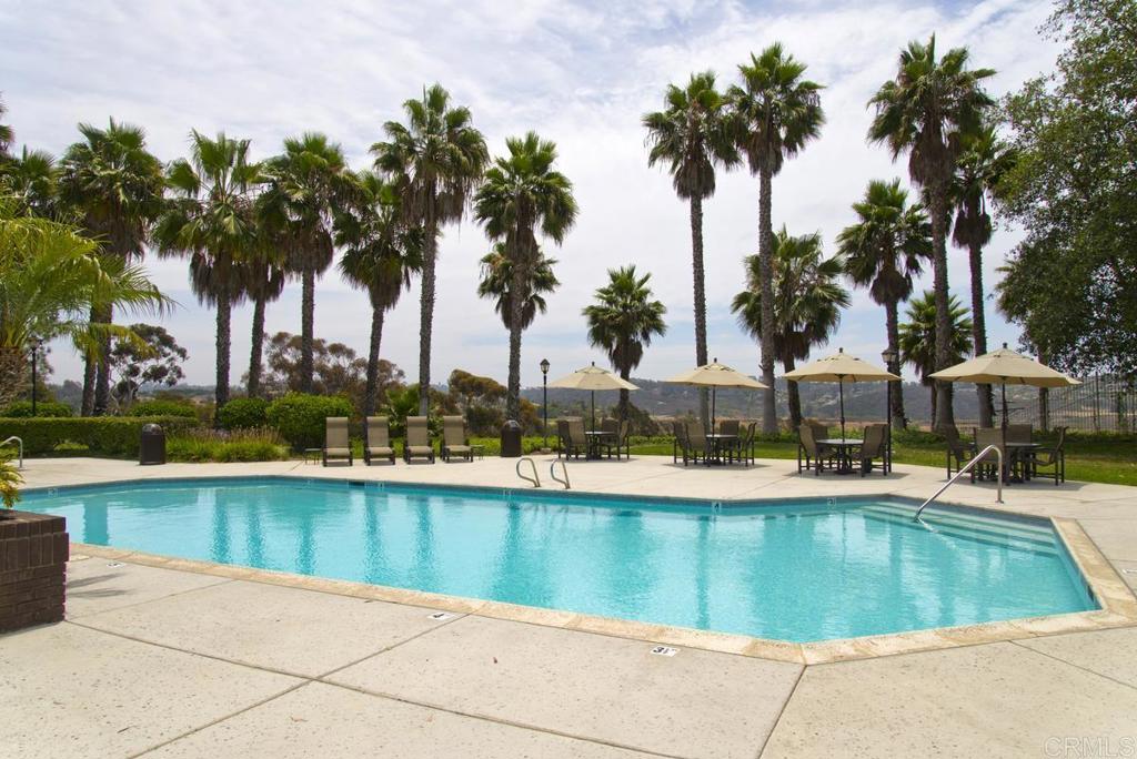 1570 Pacific Ranch Drive Encinitas, CA 92024 - Photo 33 of 35 a view of swimming pool with outdoor seating and palm trees