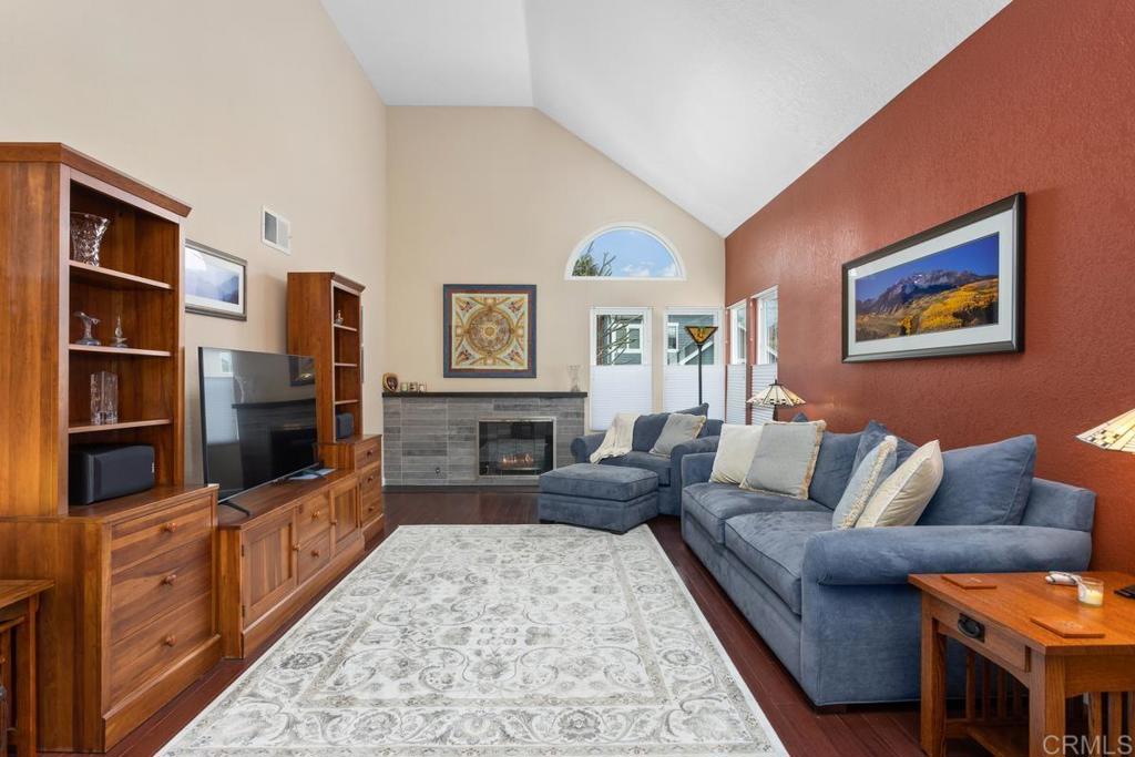 1570 Pacific Ranch Drive Encinitas, CA 92024 - Photo 5 of 35 a living room with furniture flat screen tv and a couch
