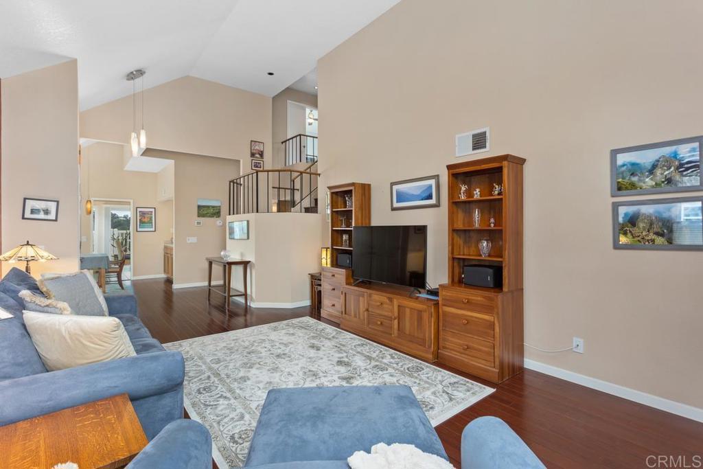 1570 Pacific Ranch Drive Encinitas, CA 92024 - Photo 6 of 35 a living room with furniture and a flat screen tv