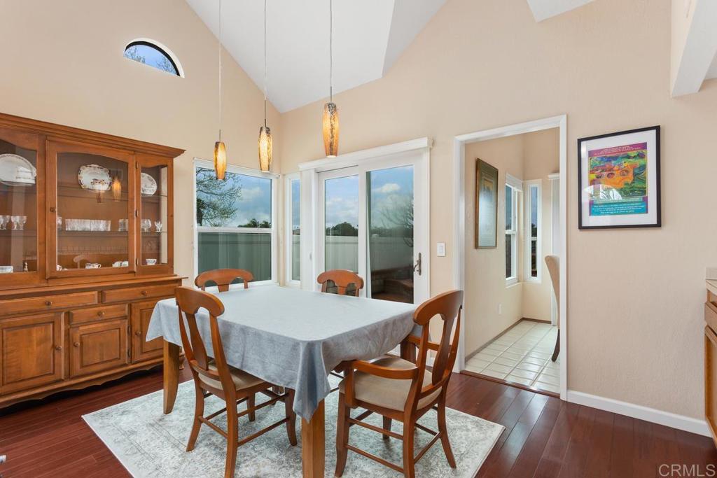 1570 Pacific Ranch Drive Encinitas, CA 92024 - Photo 7 of 35 a view of a dining room with furniture large windows and wooden floor